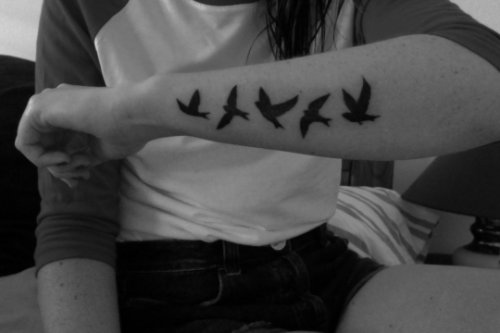 Amazing Black And White Flying Birds Tattoo